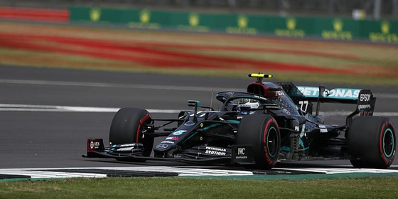 mercedes_driver_valtteri_bottas_steers_his_car_during_the_qualifying_session_at_the_70th_anniversary_f1_grand_prix_at_the_silverstone_circuit_silverstone_england_aug._8_2020._ap.jpeg